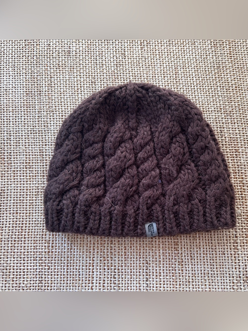 The North Face Kids Brown Cable Knit Beanie with Fleece Lined Inside Rim. OS
